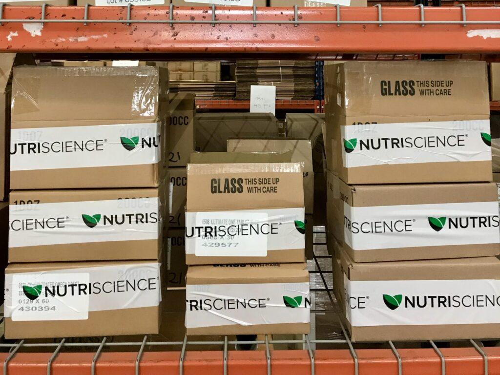 Finished goods on pallet racking in the warehouse, labelled by lot number
