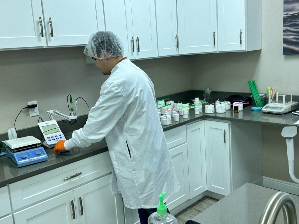 Bench testing a new formula on the lab meter, with ingredient samples lined up behind