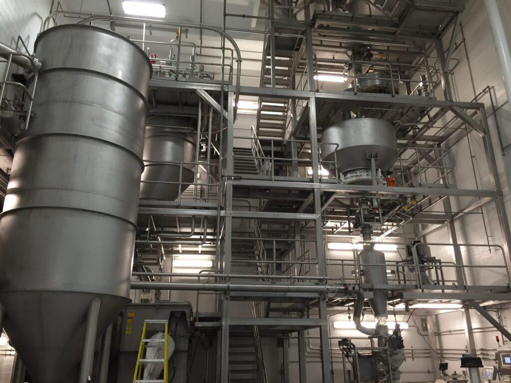 Blending and processing towers at a manufacturing plant